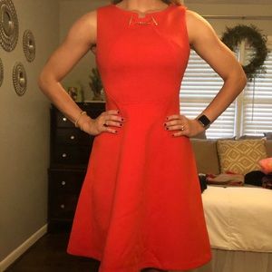 Ivanka Trump red orange dress with gold details